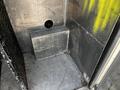 Interior view of a 2008 Morgan Olson Workhorse with metal walls and a rectangular metal platform in the corner