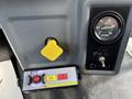 Dashboard controls of a 2016 Ford F-750 including a yellow PTO switch and gauges for air pressure and PTO mode