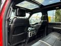 Interior view of a 2019 Ford F-150 showing black leather seating and a sunroof
