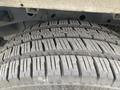 Close-up of the tread on a tire from a 2018 Ford F-150 showcasing detailed patterns and grooves designed for traction and performance