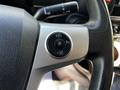 Close-up of the steering wheel controls of a 2021 Hino 338 featuring buttons for resume, off, and set functions