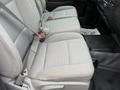 Gray fabric seats in the front row of a 2016 GMC Sierra 1500 with seat belts fastened
