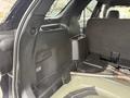 Interior view of a 2019 Ford Explorer showing the back seat area with a console and storage compartments