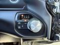 Close-up of the gear shift dial and drive mode selector in a 2021 RAM 3500 displaying the current gear position and options for 2WD and 4WD modes