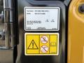 Label and safety information for a 2022 Caterpillar 306 excavator illustrating operational guidelines and specifications