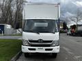 Front view of a 2019 Hino 195 box truck with a white exterior and large windshield