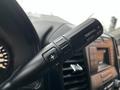 Close-up of the gear selector lever on a 2016 Ford F-150 featuring options for tow haul and sport modes