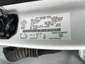 A white label attached to the interior of a 2016 Ford F-150 providing vehicle specifications and identification information