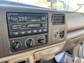 Dashboard of a 2000 Ford F-350 SD featuring a radio climate controls and various knobs