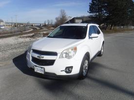 A white 2011 Chevrolet Equinox parked with a slightly angled view showcasing its front and side panels