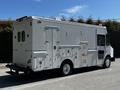A 2009 Morgan Olson Workhorse vehicle with a white exterior featuring side doors and utility compartments visible on the side