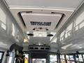 Interior ceiling view of a 2020 Chevrolet Express with an emergency exit sign and ventilation system visible