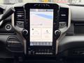 Interior view of a 2024 RAM 5500 featuring a large touchscreen display with navigation and various app icons visible on the screen