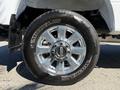 Close-up of the wheel and tire of a 2017 Ford F-350 SD featuring a shiny chrome rim and a Michelin tire