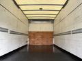 Interior of a 2008 International CityStar truck showing a spacious, empty cargo area with wooden walls and metal tie rails
