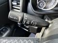 A close-up of the windshield wiper control lever in a 2019 RAM 1500 featuring settings for mist low and high as well as front wiper activation