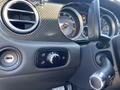 Close-up view of the interior controls of a 2015 Bentley Continental GT featuring a sleek dashboard and various dials for functionality