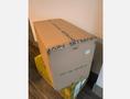 A cardboard box labeled Bitmain containing a Bitmain Antminer S21 Pro 234Th SHA256 BTC Asic Miner priced at $500USDT