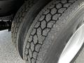 Close-up of a set of dual tires from a 2020 Hino 338 featuring a tread pattern designed for traction and stability