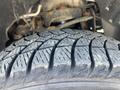 Close-up of a tire on a 2013 Ford Expedition displaying detailed tread patterns and worn surface showing signs of use