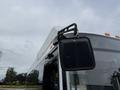 A 2018 Grande West Vicinity bus with a prominent side mirror attached to the bus body