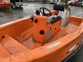 A 2008 Fassmer 20 Foot Fast Rescue boat featuring an orange interior with a central console and steering wheel ready for operation