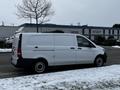 A 2019 Mercedes-Benz Metris van in white with sliding side doors and no visible branding parked on snowy ground