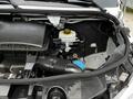 A 2023 Mercedes-Benz Sprinter engine compartment showing the air intake system and coolant reservoir with various components and tubing