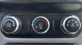 Three climate control dials for the air conditioning and heating system in a 2019 RAM 3500 including settings for airflow temperature and functions