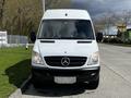 White 2012 Mercedes-Benz Sprinter van parked with a prominent front view showcasing the iconic Mercedes emblem on the grille