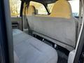 Interior of a 2008 Ford F-250 SD featuring a bench seat covered in light gray fabric