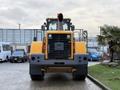 A yellow Hyundai XG 350 construction vehicle with a large front scoop and exhaust pipe visible at the top