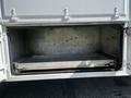 Interior view of a 2004 Freightliner M2 cargo area showing a metal frame with no visible cargo or contents