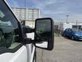 A white 2008 Ford F-250 SD pickup truck with a side mirror visible in the foreground