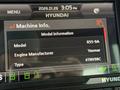 A digital display showing machine information for a 2022 Hyundai R55-9A including model, engine manufacturer Yanmar, and engine type 4TNV98C