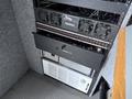 A 2011 Ford F-650 showcasing its operational interior with various electronic components and equipment neatly organized in a rack system