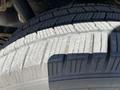 Close-up of a tire from a 2014 Ford F-150 showing tread patterns and textures