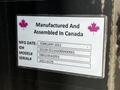 A label on a Ford F-550 indicating it was manufactured and assembled in Canada with details including the MFG date of February 2021 and model number DB5119142053