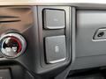 Close-up of the dashboard controls in a 2024 Ford F-550 featuring buttons for 12V power and a battery symbol