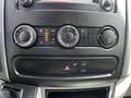 Interior dashboard controls of a 2017 Mercedes-Benz Sprinter including climate control knobs and various function buttons