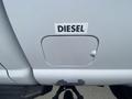A close-up of a 2016 Ford F-350 SD fuel door with a label that reads DIESEL