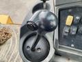 Close-up of a joystick control lever for a 2012 John Deere 310SJ heavy equipment machine
