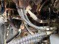 Close-up of hydraulic hoses and connections on a 2018 Doosan DL300-5 construction equipment showing a complex arrangement of pipes and fittings