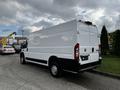 White 2019 RAM Promaster parked with a blank rear door and black accents