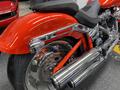 2024 Harley Davidson Fat Boy showcasing a vibrant red finish sleek chrome details and a distinctive fat rear tire design