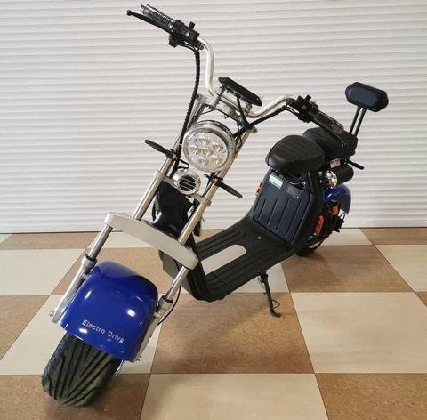 A blue Citycoco electric scooter featuring a muscular design 4000W motor and a headlight with a top speed of 40MPH