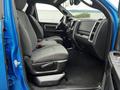 Interior view of a 2021 RAM 1500 Classic showing the front driver's and passenger's seats in gray fabric