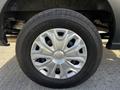A close-up of a silver wheel rim from a 2017 Ford Transit featuring a distinct design and mounted on a Continental tire with visible tread patterns
