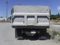 A 2005 Freightliner M2 106 Medium Duty truck viewed from the rear showcasing its boxy shape and dual rear wheels with a marked license plate