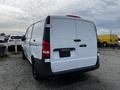 A 2018 Mercedes-Benz Metris van with a white exterior and black accents is parked with its rear doors closed
